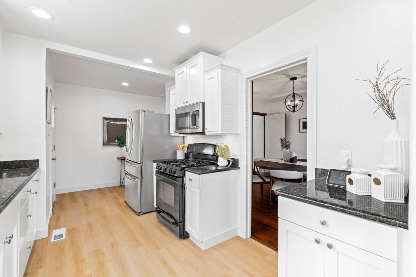 975 Riverside Drive San Jose, CA 95125 - Photo 15 of 46 a kitchen with stainless steel appliances granite countertop a stove and a sink