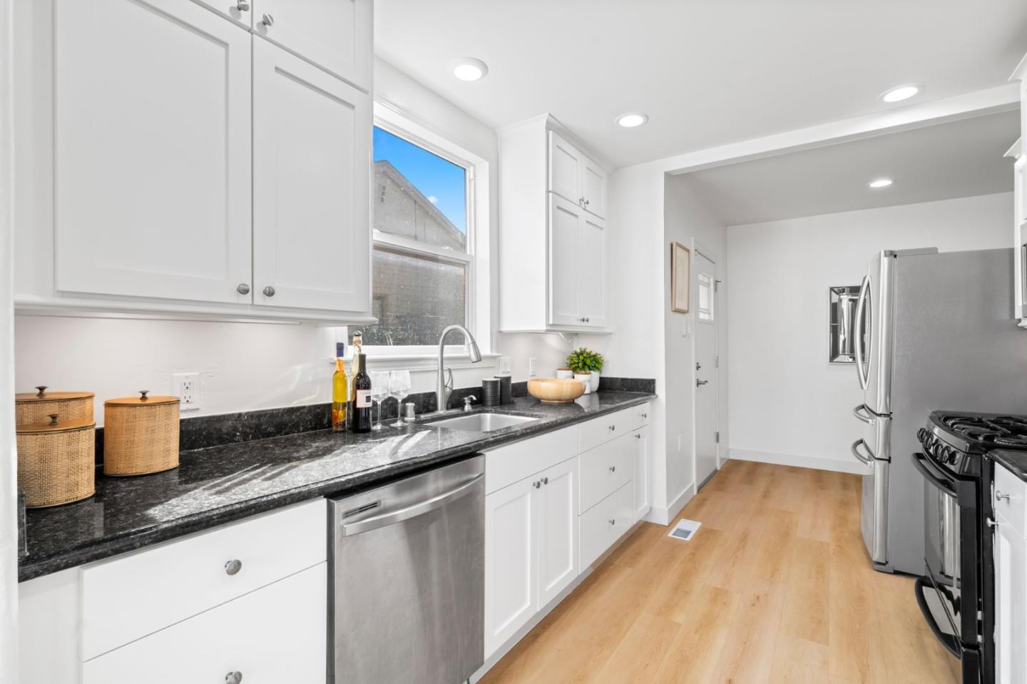 975 Riverside Drive San Jose, CA 95125 - Photo 16 of 46 a kitchen with a sink dishwasher stove and refrigerator