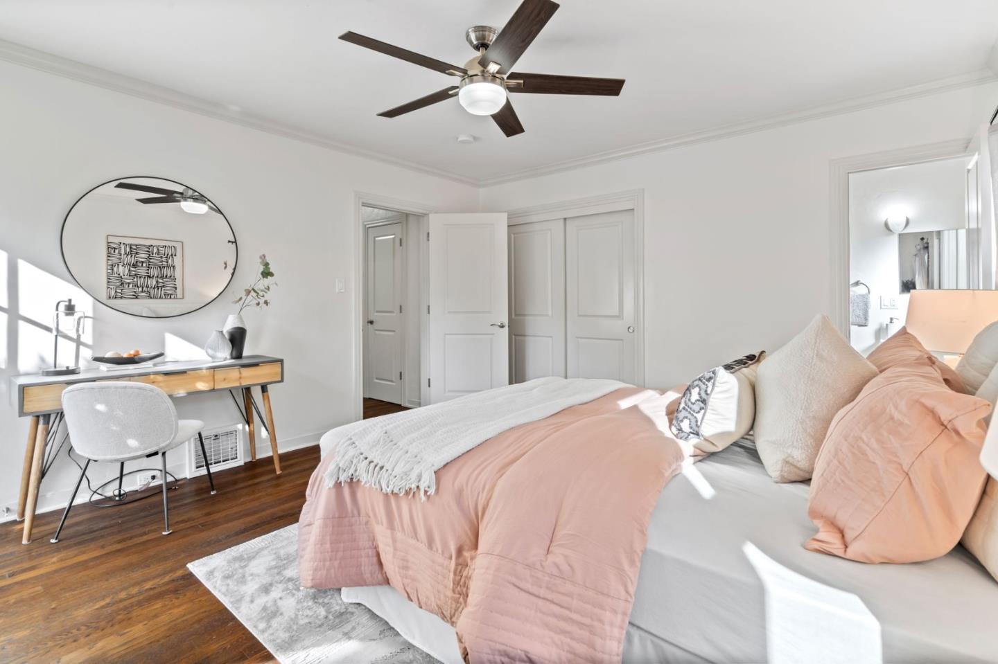 975 Riverside Drive San Jose, CA 95125 - Photo 22 of 46 a bedroom with a bed a clock on the dresser with the wooden floor