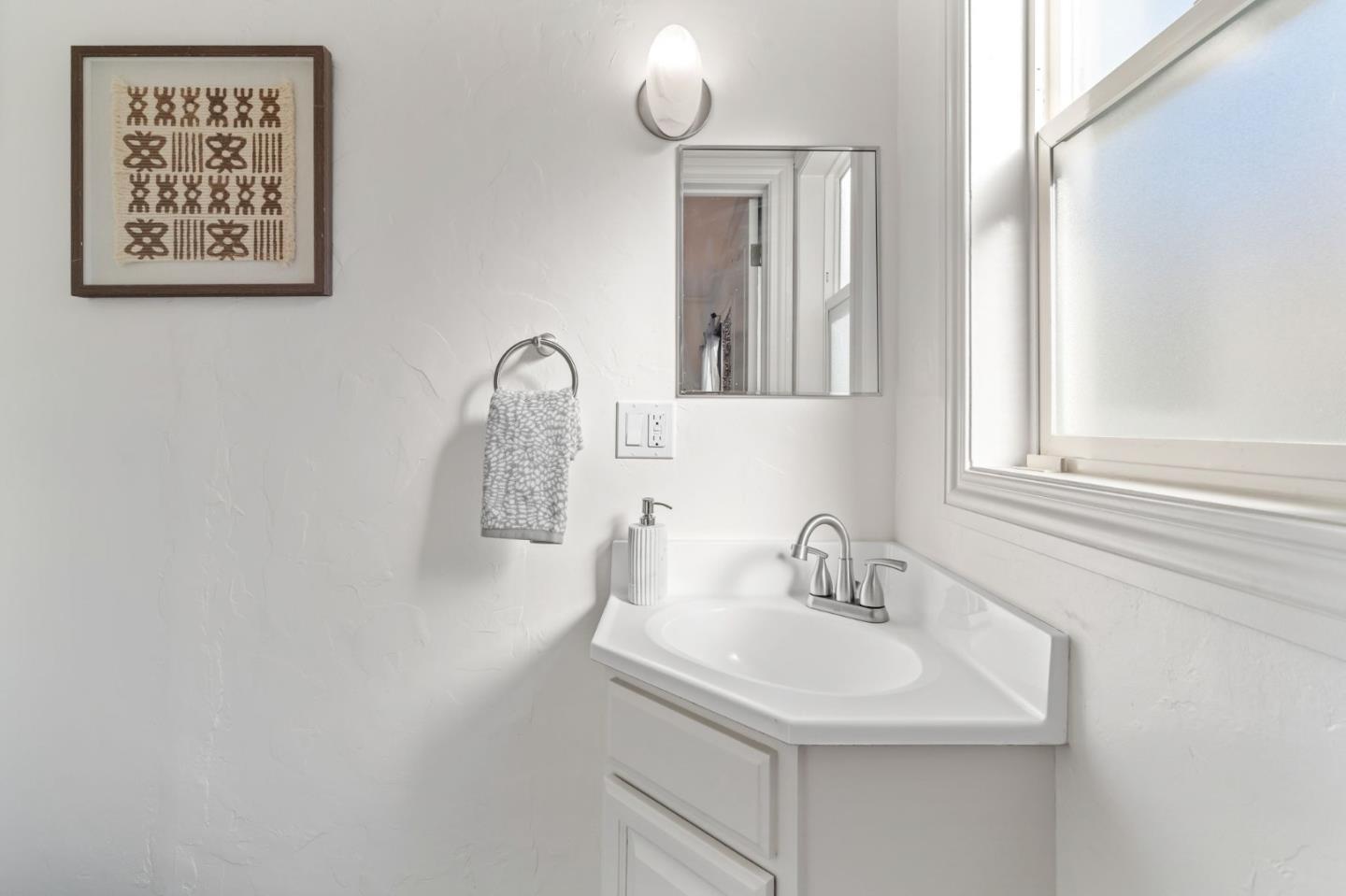 975 Riverside Drive San Jose, CA 95125 - Photo 23 of 46 a bathroom with a sink and a mirror