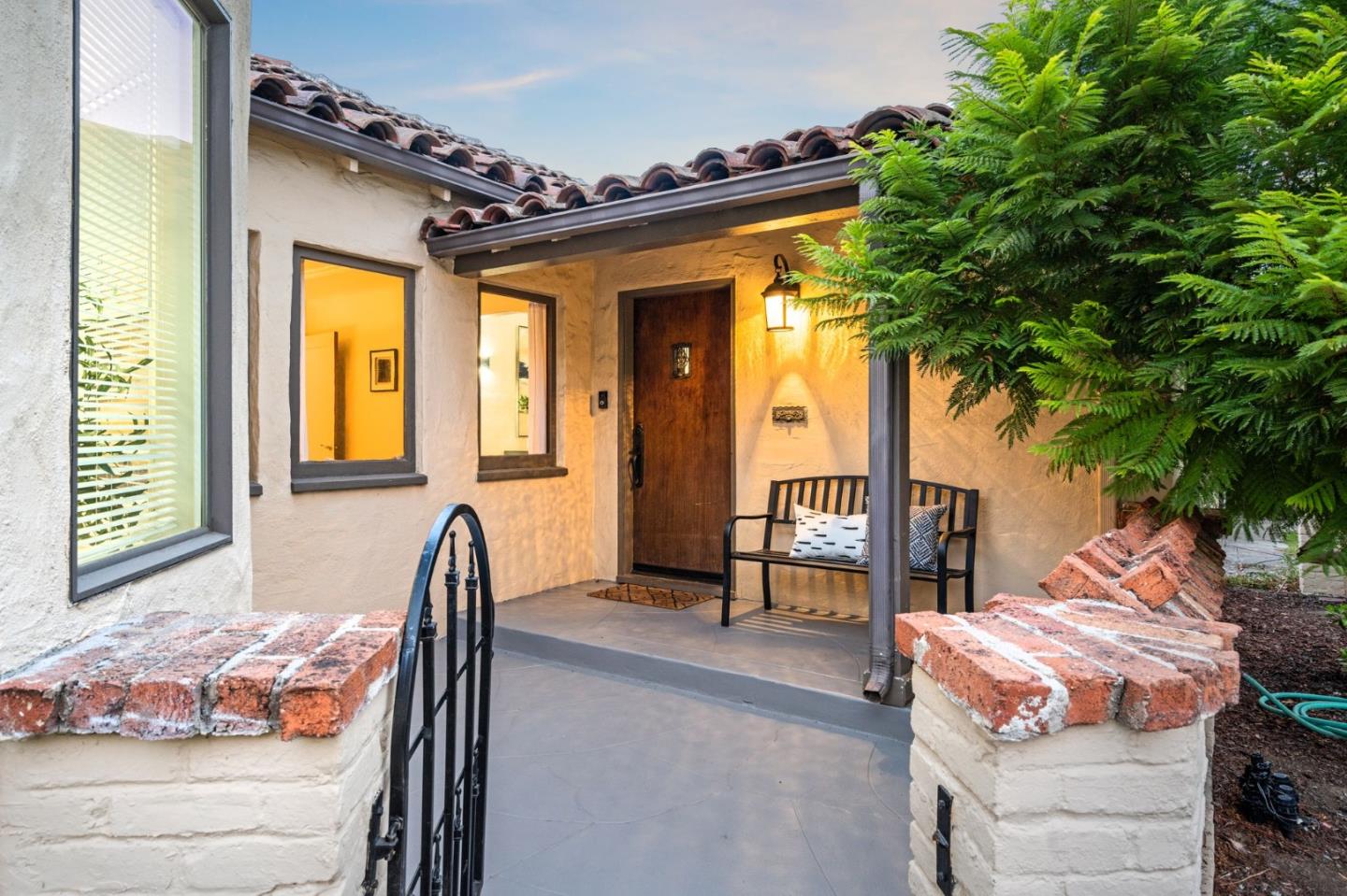 975 Riverside Drive San Jose, CA 95125 - Photo 7 of 46 a bedroom with a bed and a chandelier