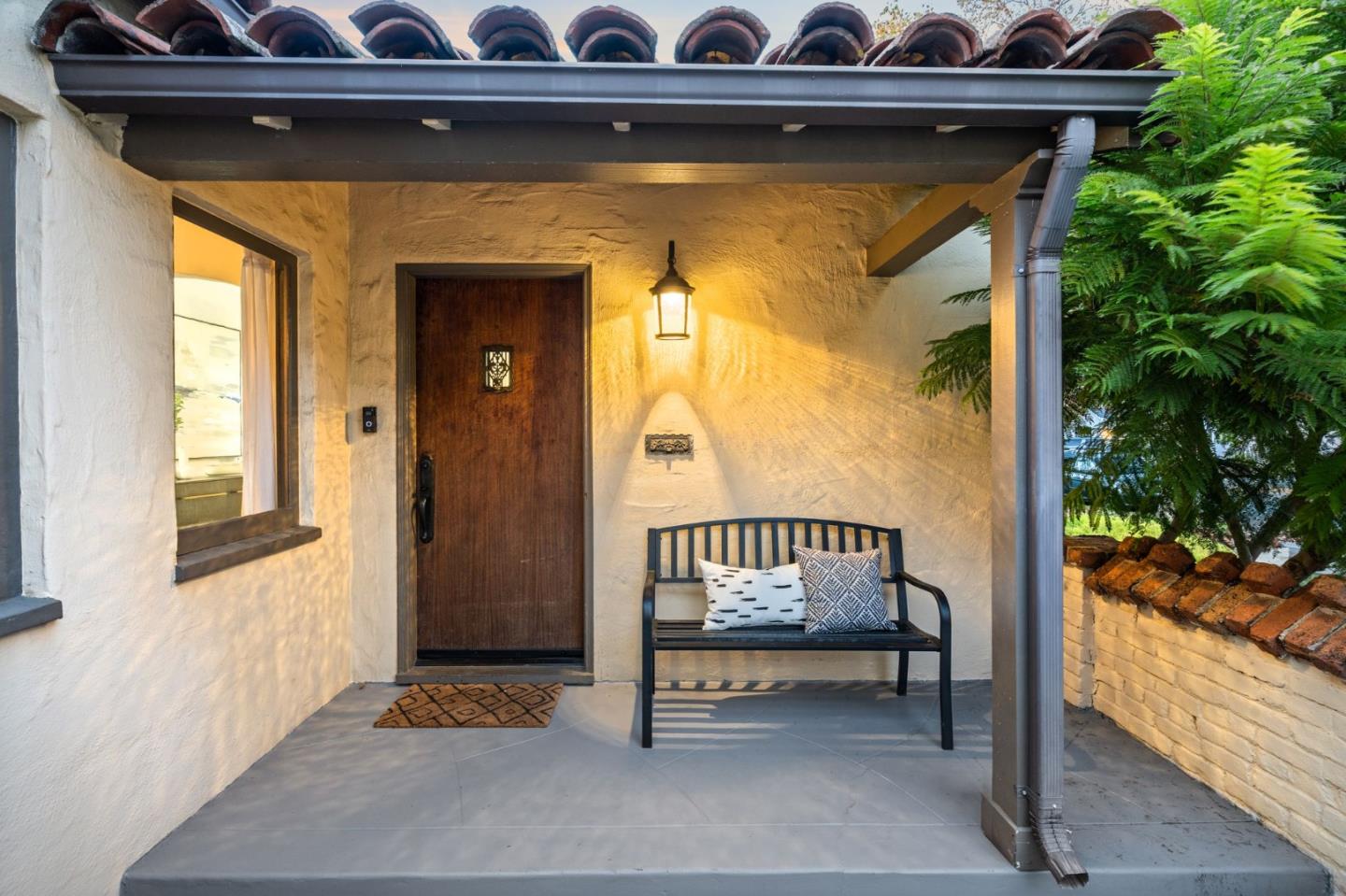 975 Riverside Drive San Jose, CA 95125 - Photo 8 of 46 a view of a door with a bench and wooden door