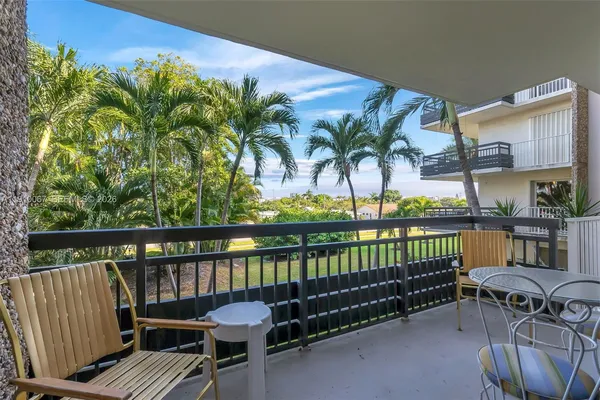 a view of a balcony with lake view and a potted plant