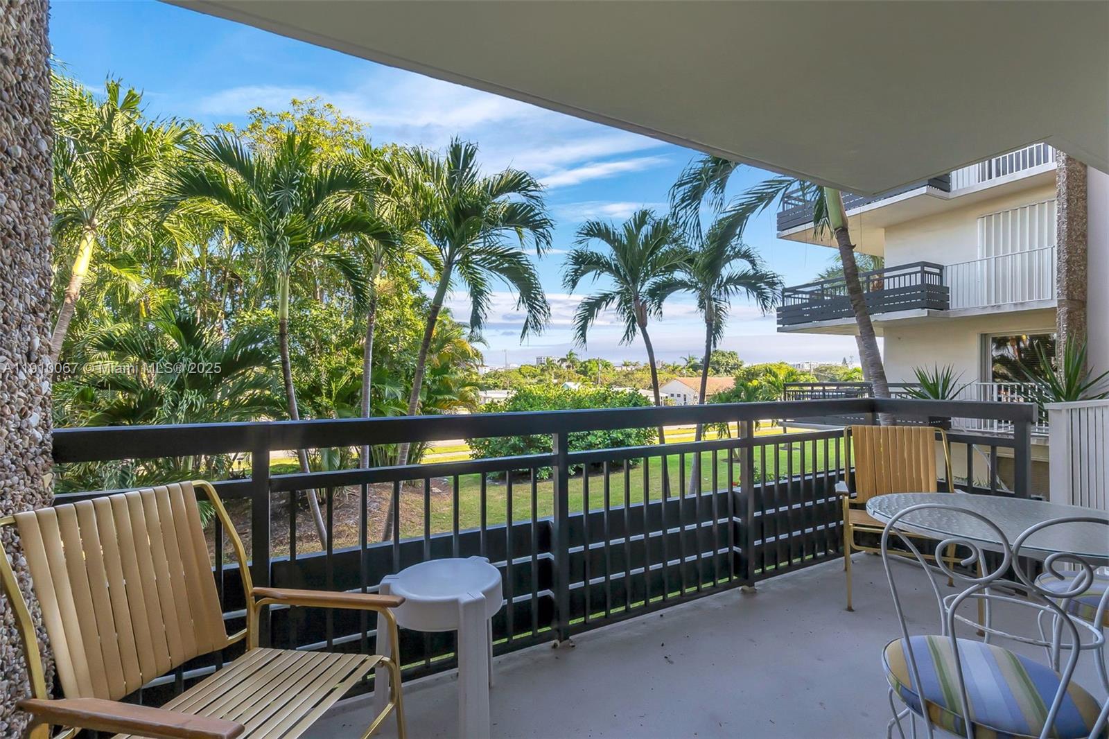 a view of a balcony with lake view and a potted plant