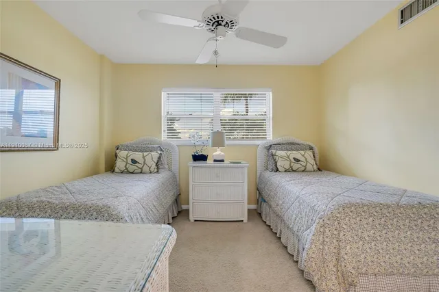 a balcony with table and chairs