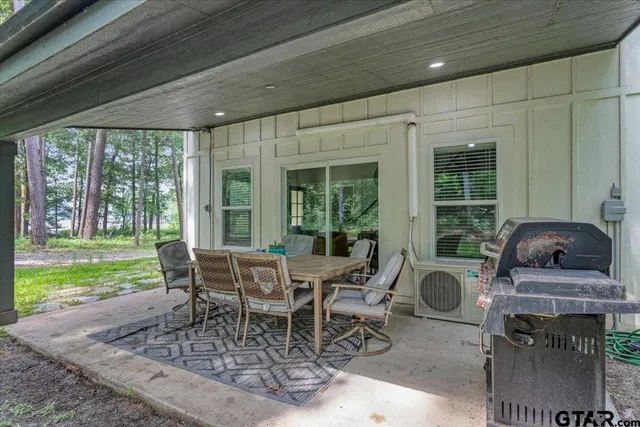 a table and chairs in front of a house