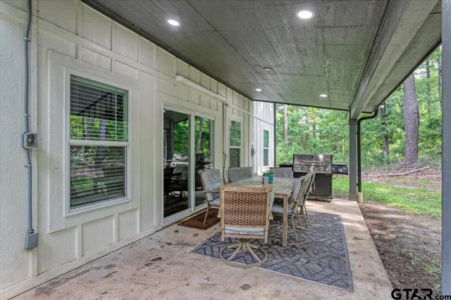 a dining room with furniture and a garden