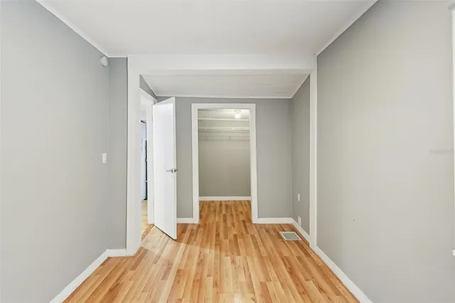 a view of an empty room with a window