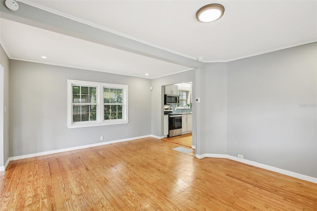 924 Vistabula Street Lakeland, FL 33801 - Photo 21 of 53 a view of empty room with wooden floor and window