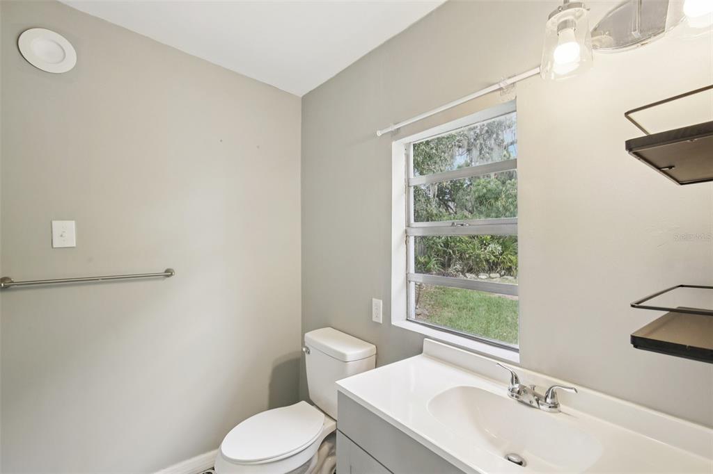 924 Vistabula Street Lakeland, FL 33801 - Photo 25 of 53 a white toilet sitting next to a bathroom sink