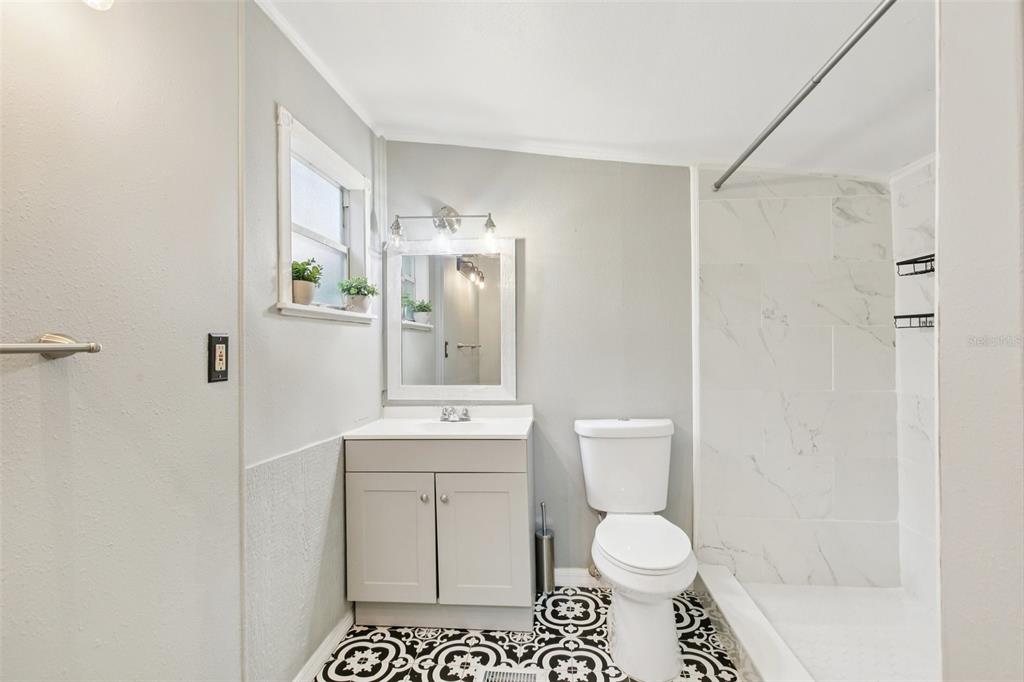 924 Vistabula Street Lakeland, FL 33801 - Photo 29 of 53 a white toilet sitting next to a bathroom sink