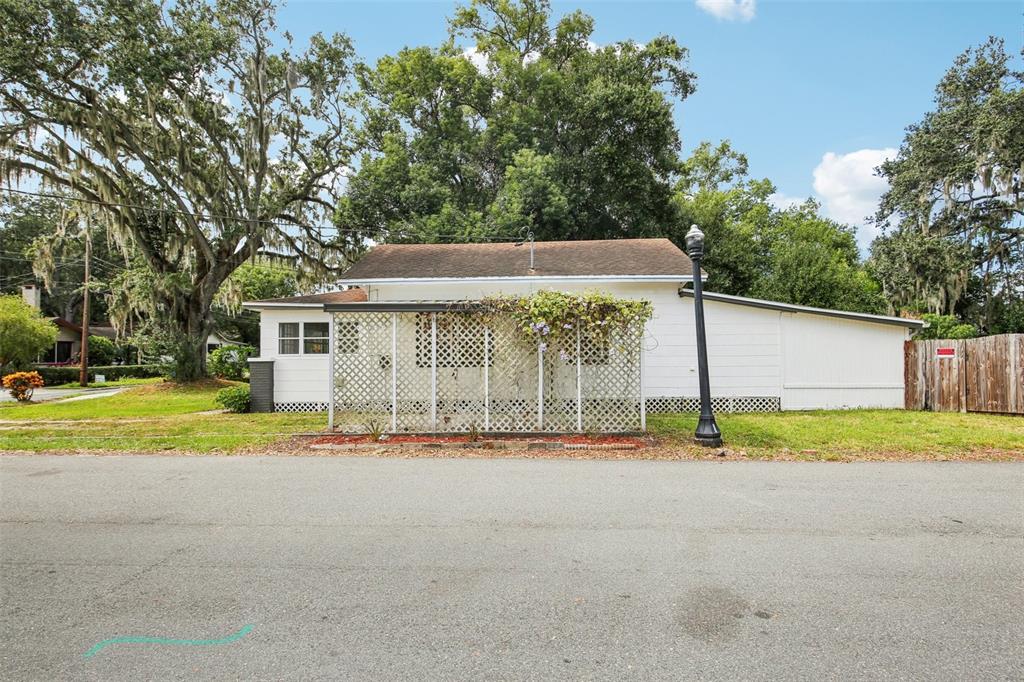 924 Vistabula Street Lakeland, FL 33801 - Photo 51 of 53 a front view of a house with a yard and trees