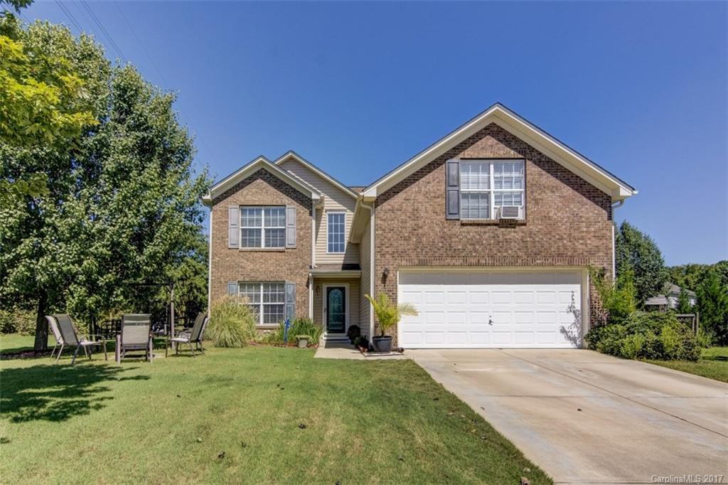 7467 Fallen Timber Lane, Unit 27 Tega Cay, SC 29708 - Photo 1 of 24 a front view of a house with a yard