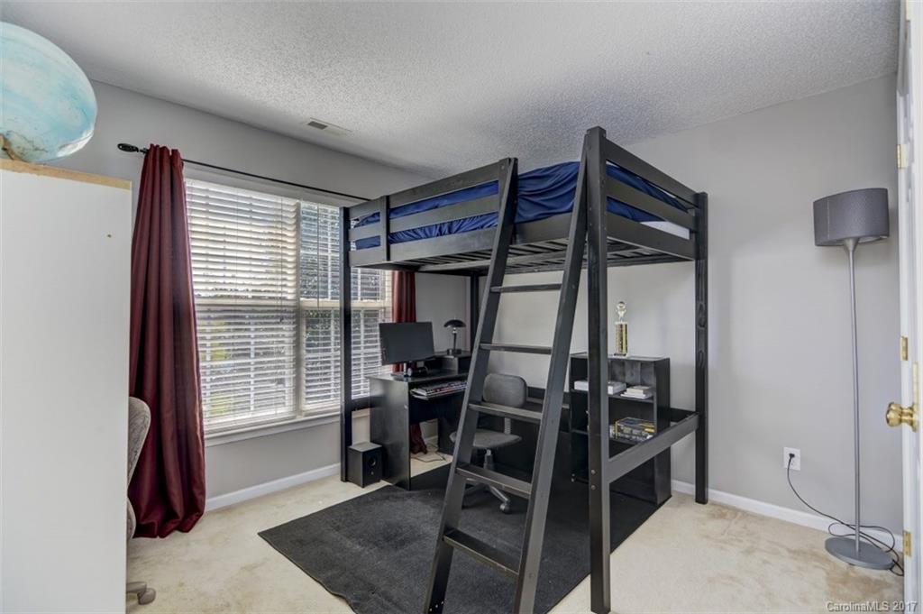 7467 Fallen Timber Lane, Unit 27 Tega Cay, SC 29708 - Photo 22 of 24 a view of a room with chairs