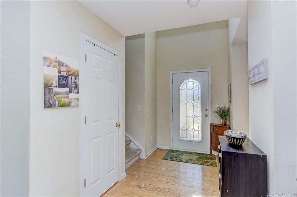 7467 Fallen Timber Lane, Unit 27 Tega Cay, SC 29708 - Photo 7 of 24 a view of a hallway with front door