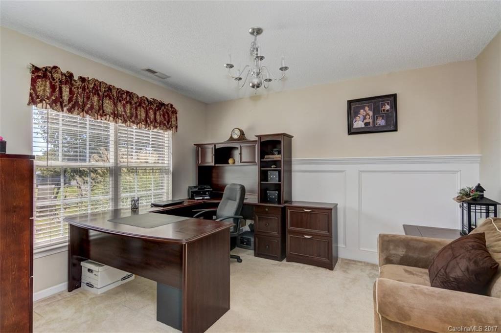 7467 Fallen Timber Lane, Unit 27 Tega Cay, SC 29708 - Photo 9 of 24 a view of a workspace with furniture and a window