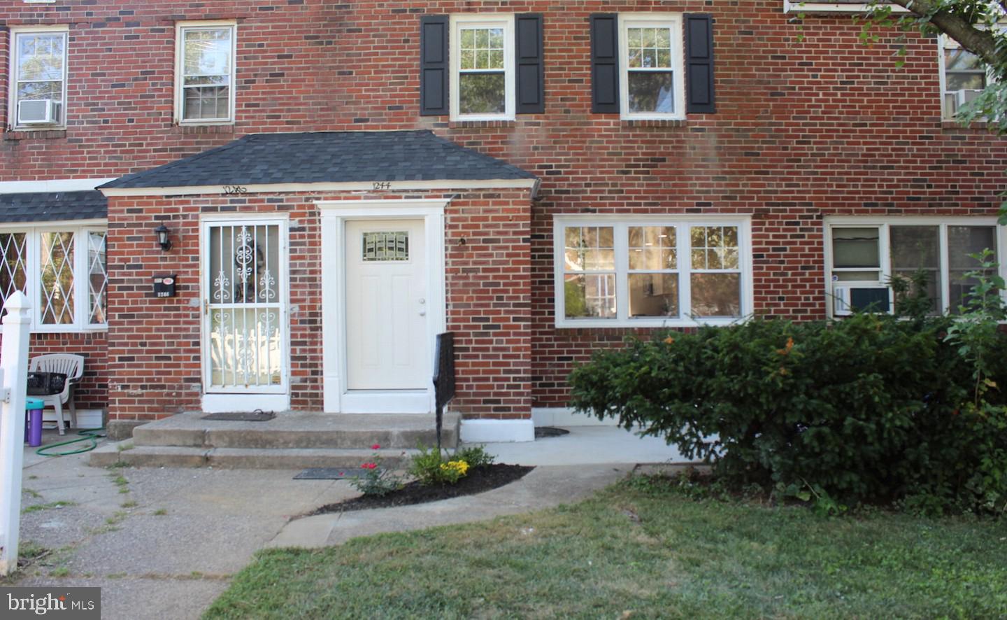1244 Elson Road Brookhaven, PA 19015 - Photo 1 of 20 a front view of a house having yard