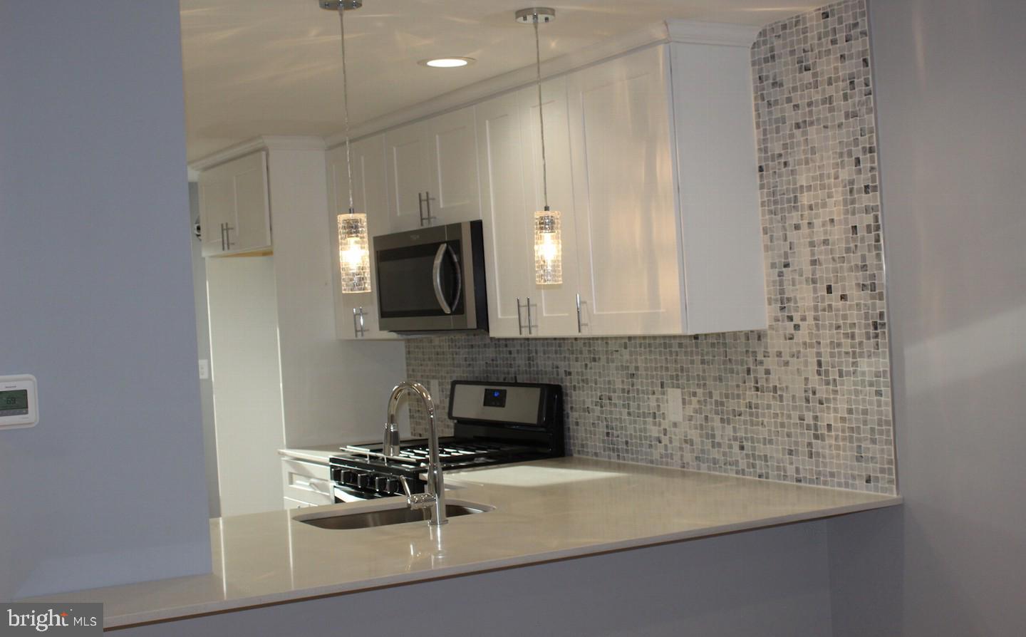 1244 Elson Road Brookhaven, PA 19015 - Photo 4 of 20 a kitchen with a sink and cabinets