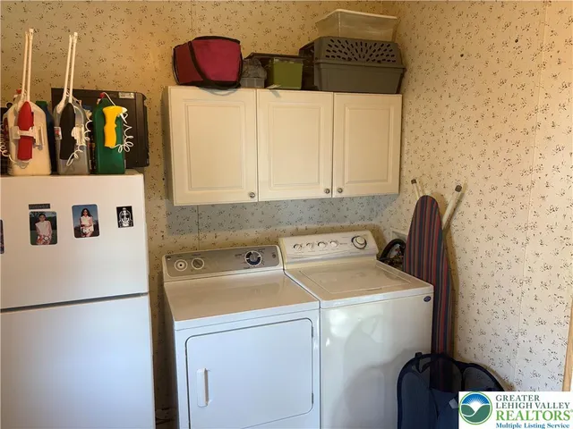 a utility room with dryer and washer