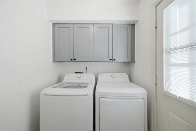 a view of storage and utility room with washer and dryer