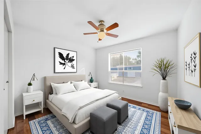 a bedroom with a large bed and a window