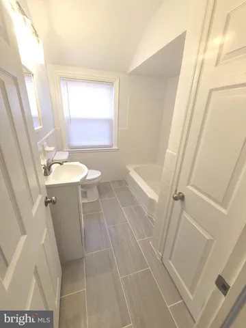 a bathroom with sink and mirror