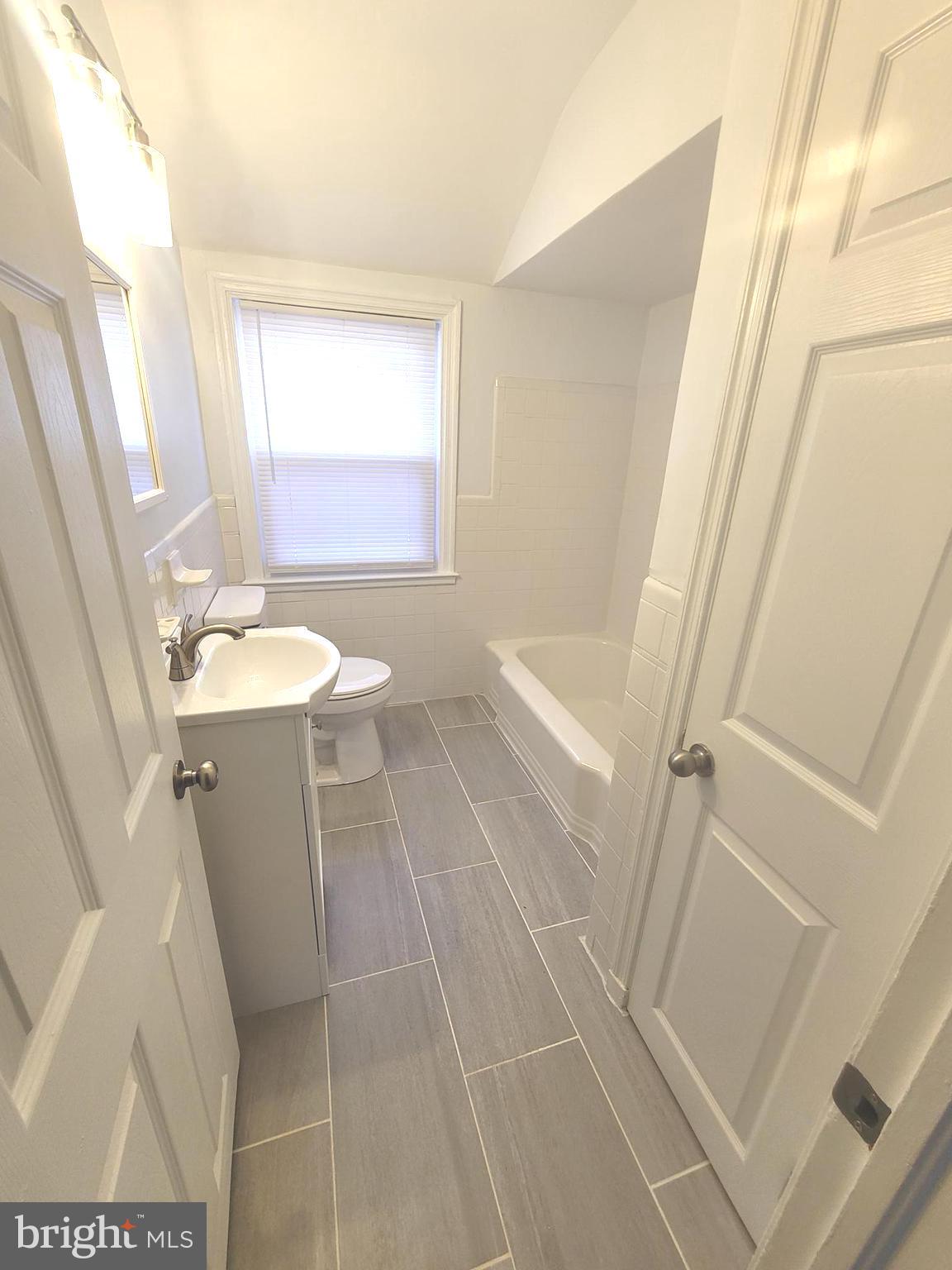 4603 Marble Hall Road Baltimore, MD 21239 - Photo 21 of 24 a bathroom with sink and mirror