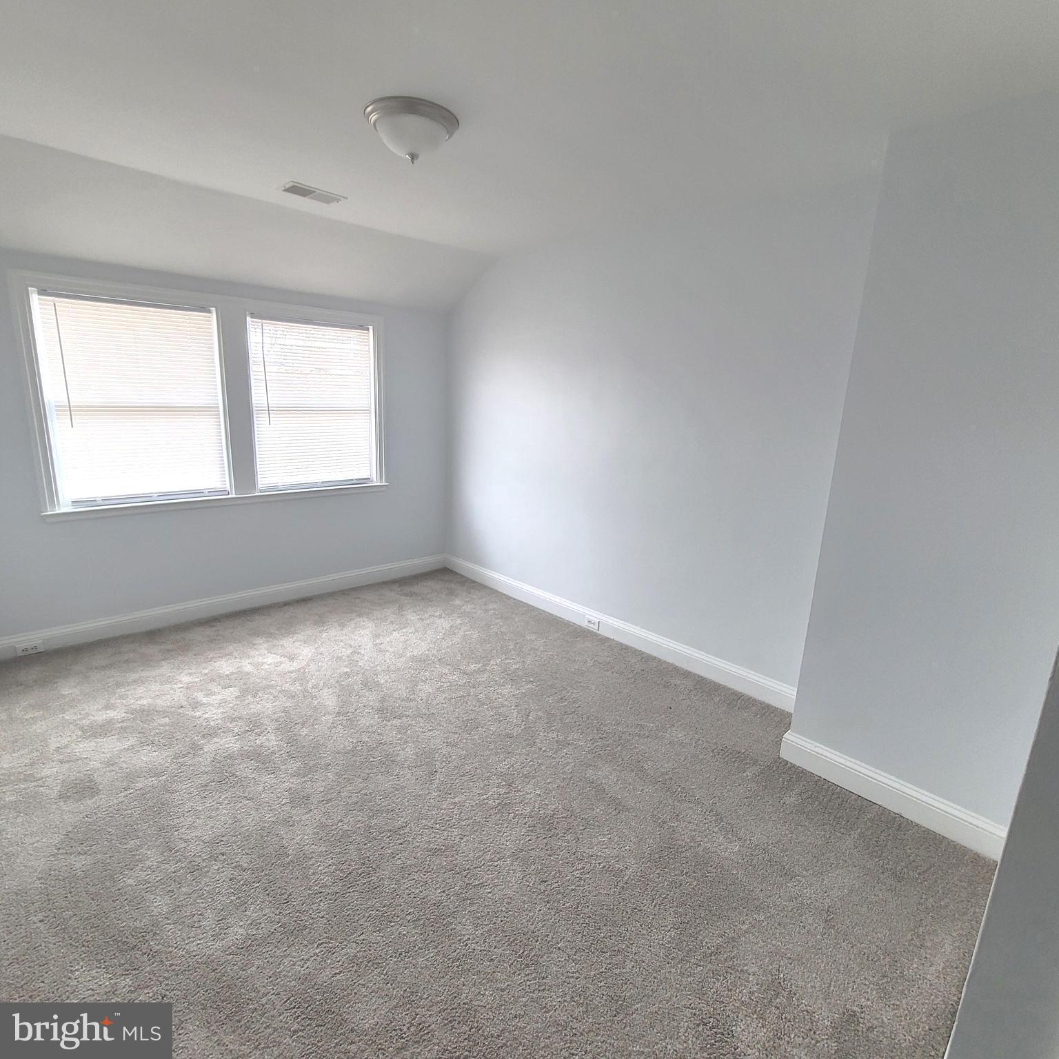 4603 Marble Hall Road Baltimore, MD 21239 - Photo 8 of 24 an empty room with a window