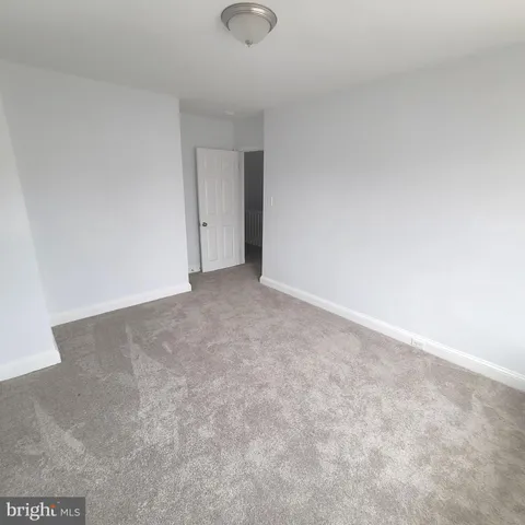 a view of an empty room and entryway