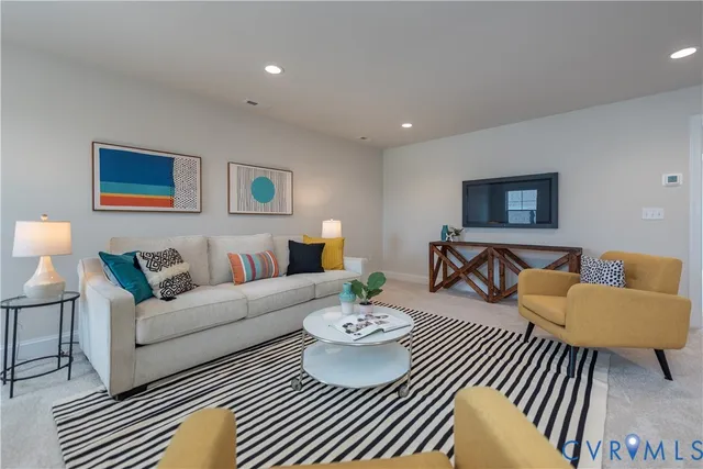 a living room with furniture and a rug