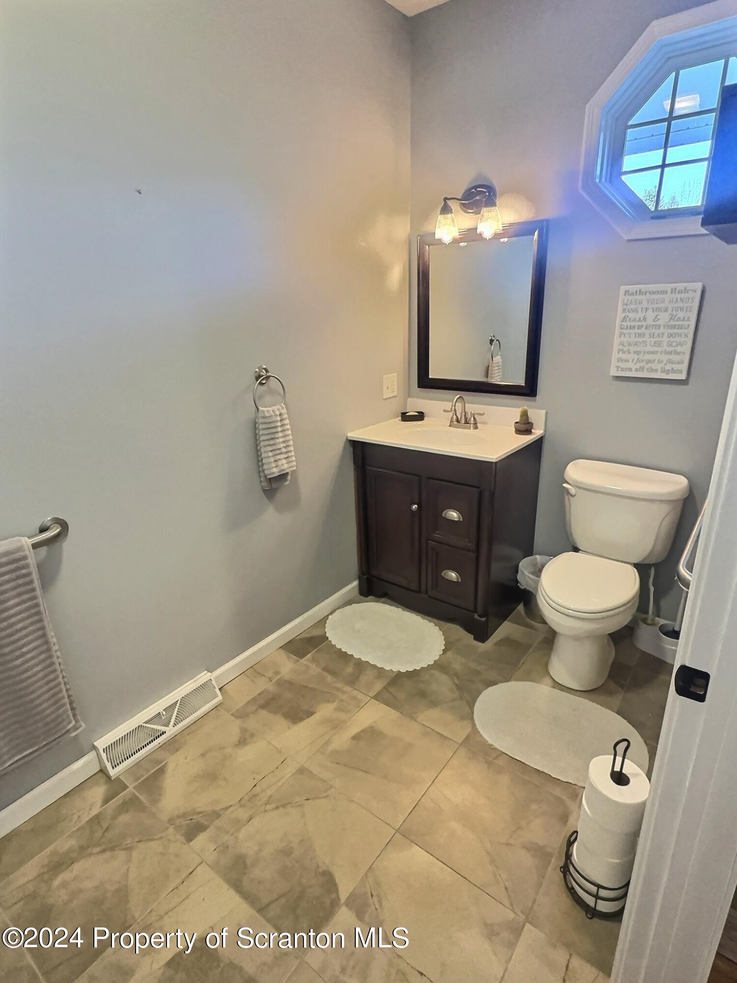 514 Brace Road Dallas, PA 18612 - Photo 22 of 49 a bathroom with a sink vanity granite and toilet