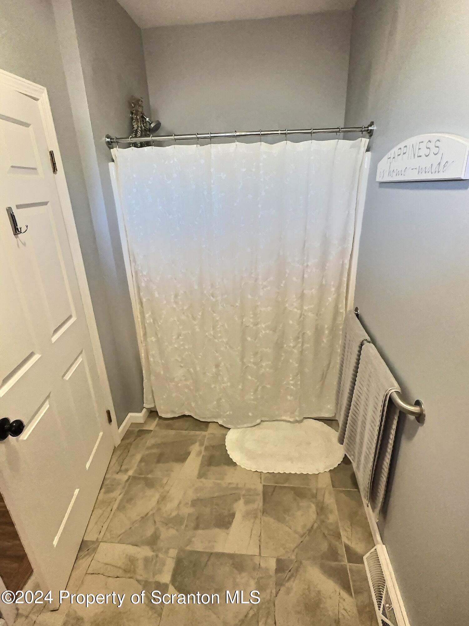 514 Brace Road Dallas, PA 18612 - Photo 23 of 49 a bathroom with a granite countertop shower and a toilet