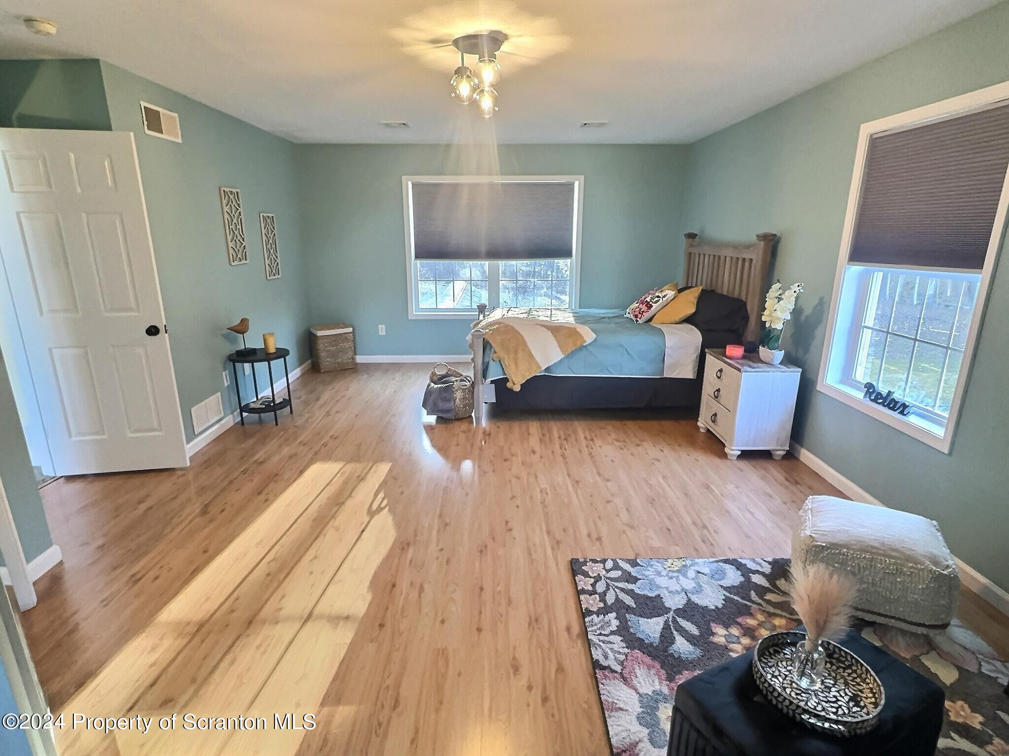514 Brace Road Dallas, PA 18612 - Photo 28 of 49 a bedroom with furniture and a wooden floor