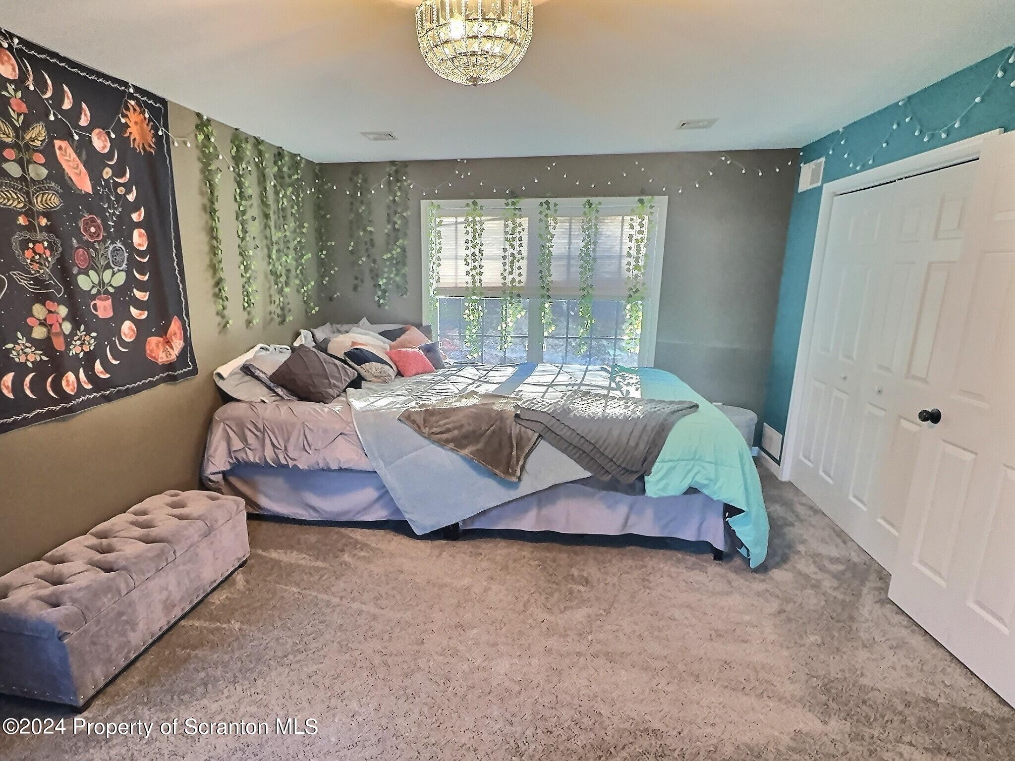 514 Brace Road Dallas, PA 18612 - Photo 33 of 49 a bedroom with bed and a window