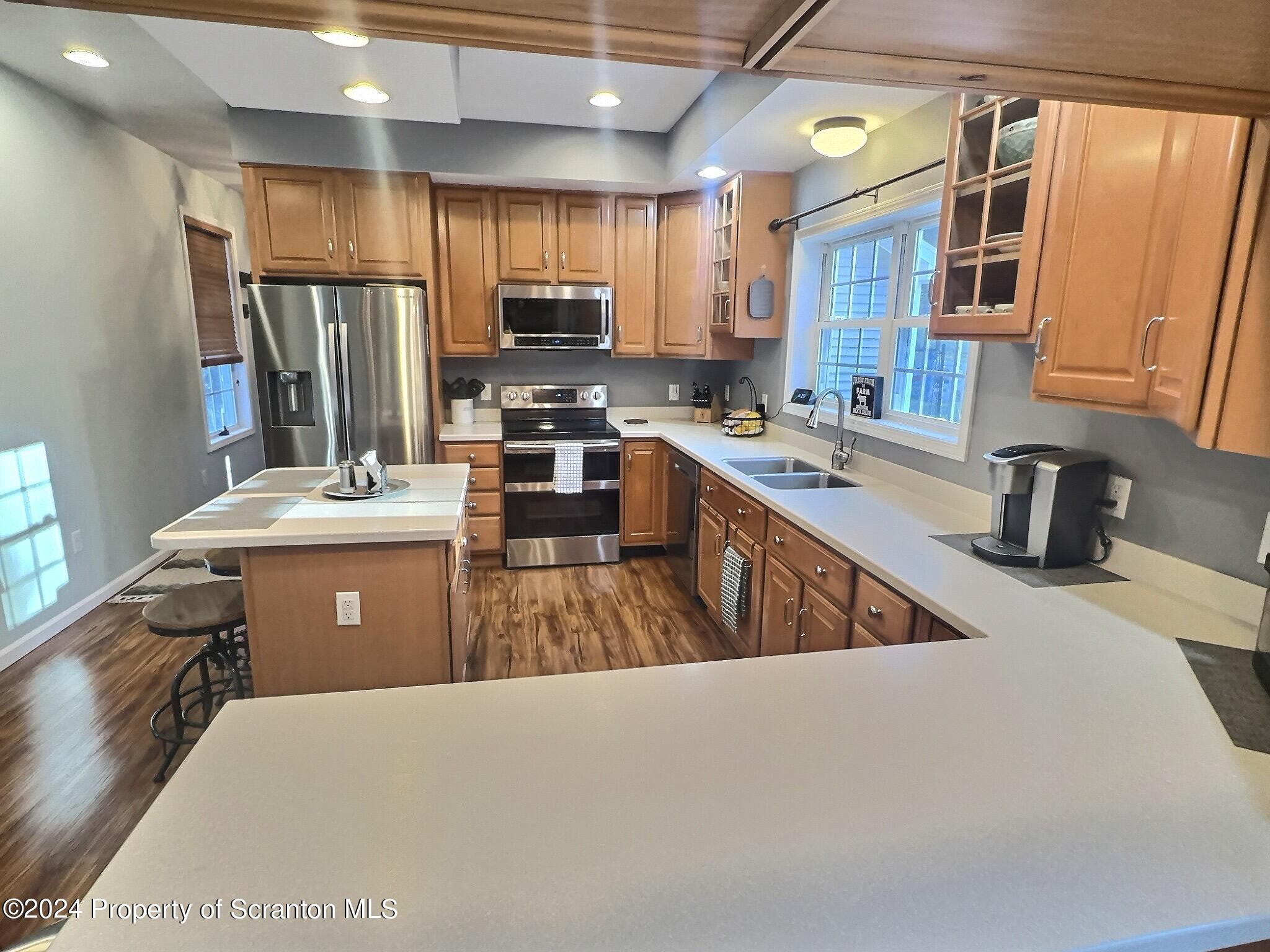 514 Brace Road Dallas, PA 18612 - Photo 4 of 49 a kitchen with stainless steel appliances a sink dishwasher stove top oven and refrigerator