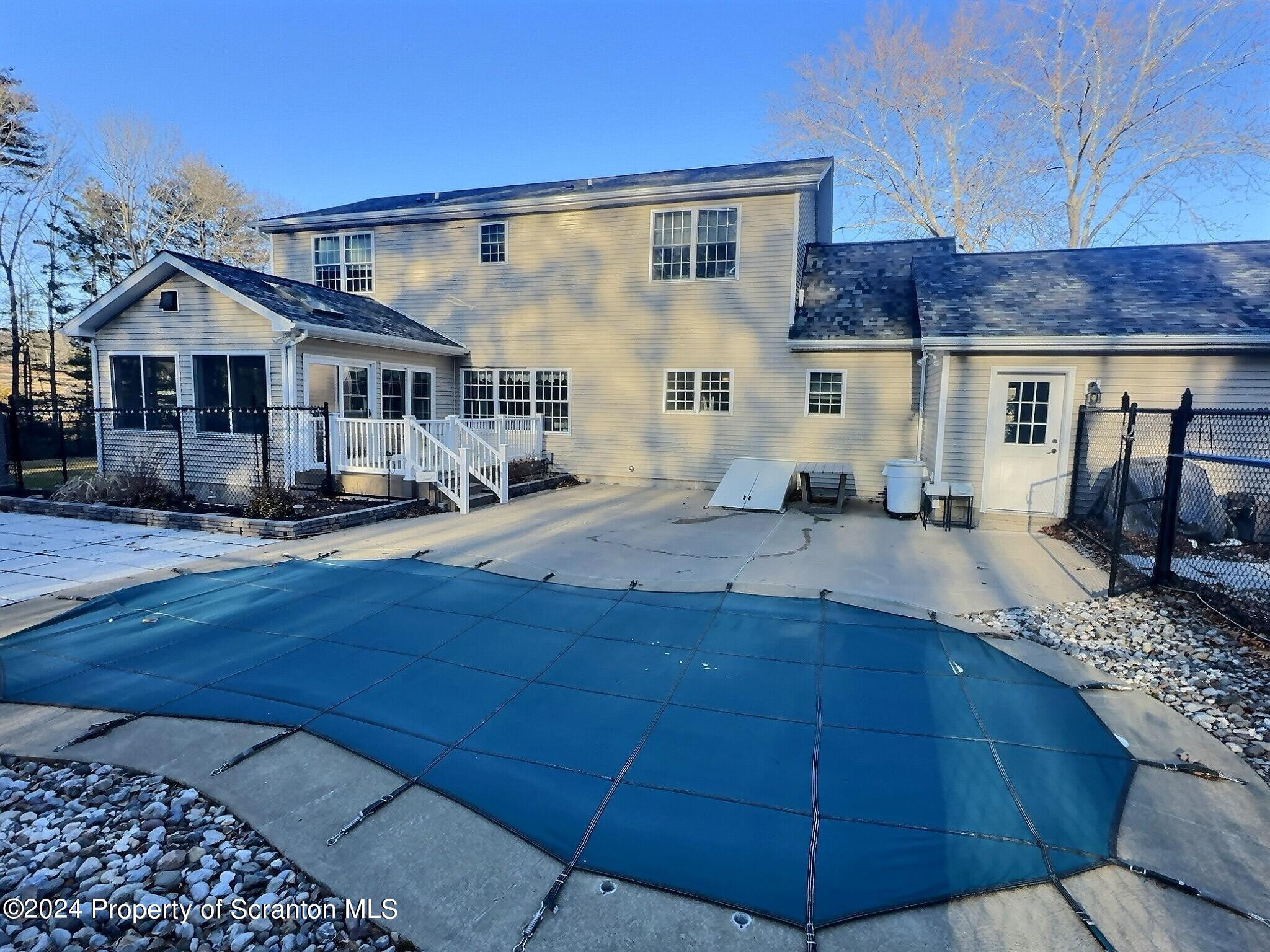 514 Brace Road Dallas, PA 18612 - Photo 42 of 49 a view of a house with a patio
