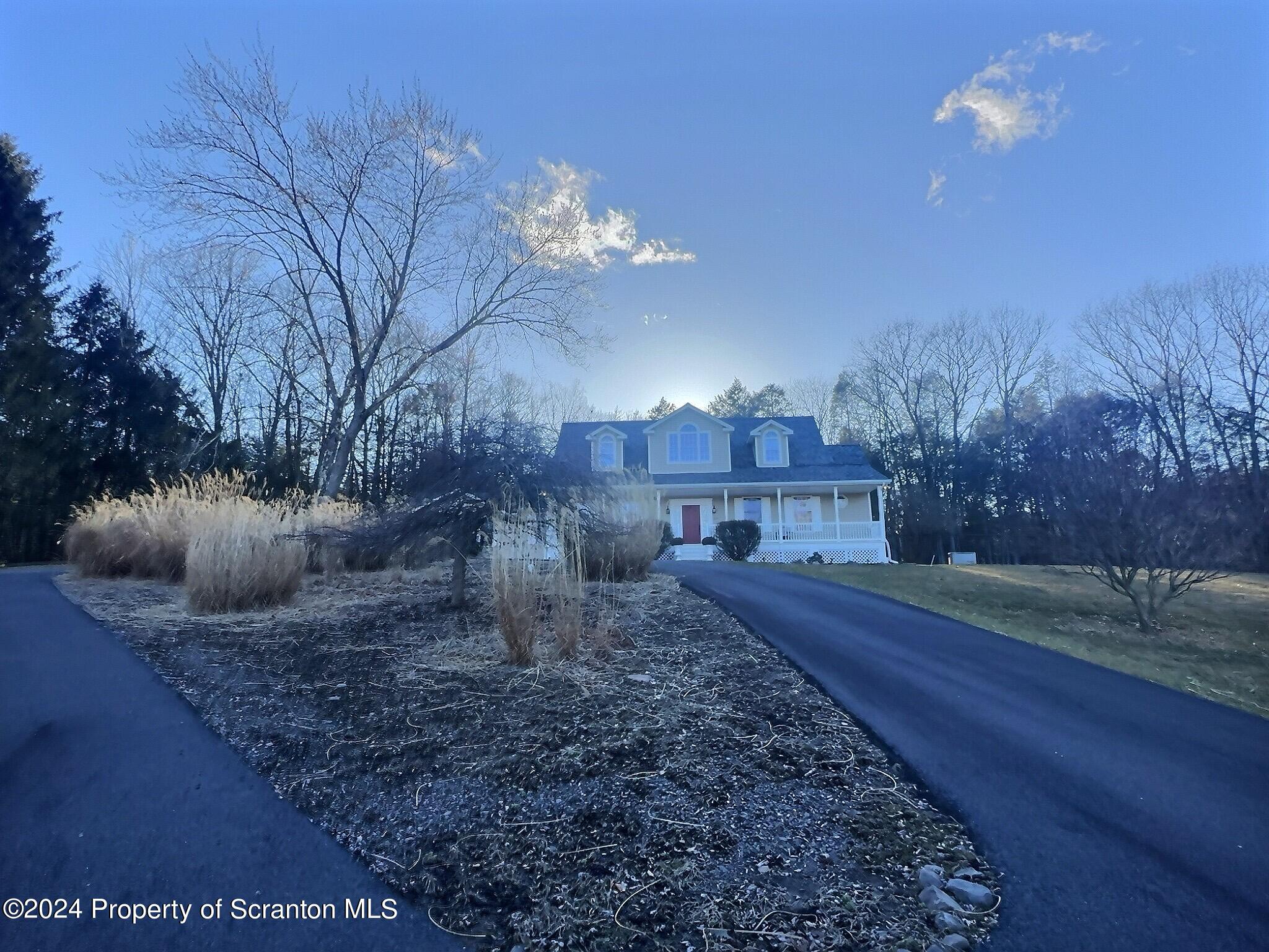 514 Brace Road Dallas, PA 18612 - Photo 49 of 49 a view of a house with a yard