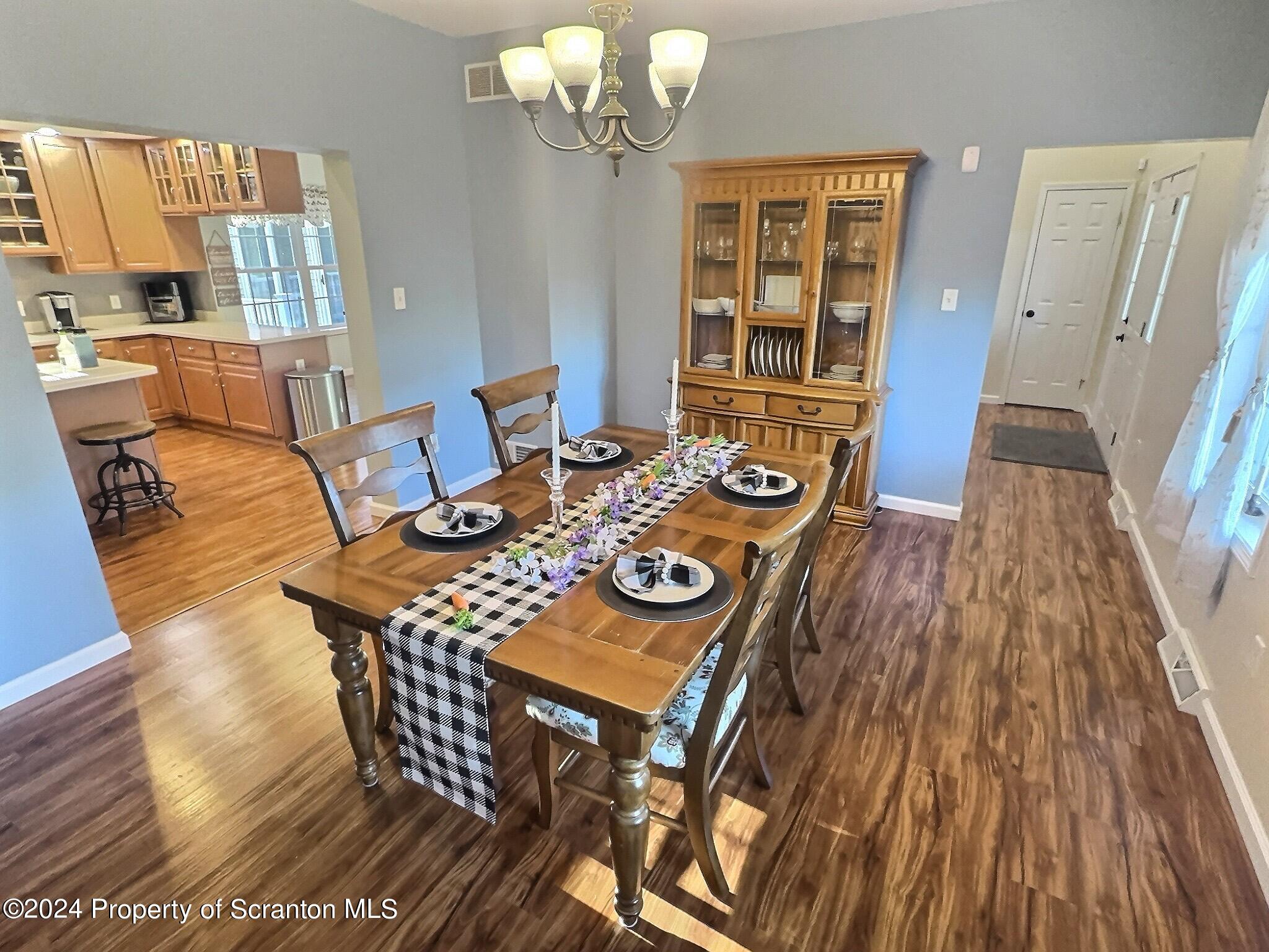 514 Brace Road Dallas, PA 18612 - Photo 7 of 49 a view of a dining room with furniture and wooden floor