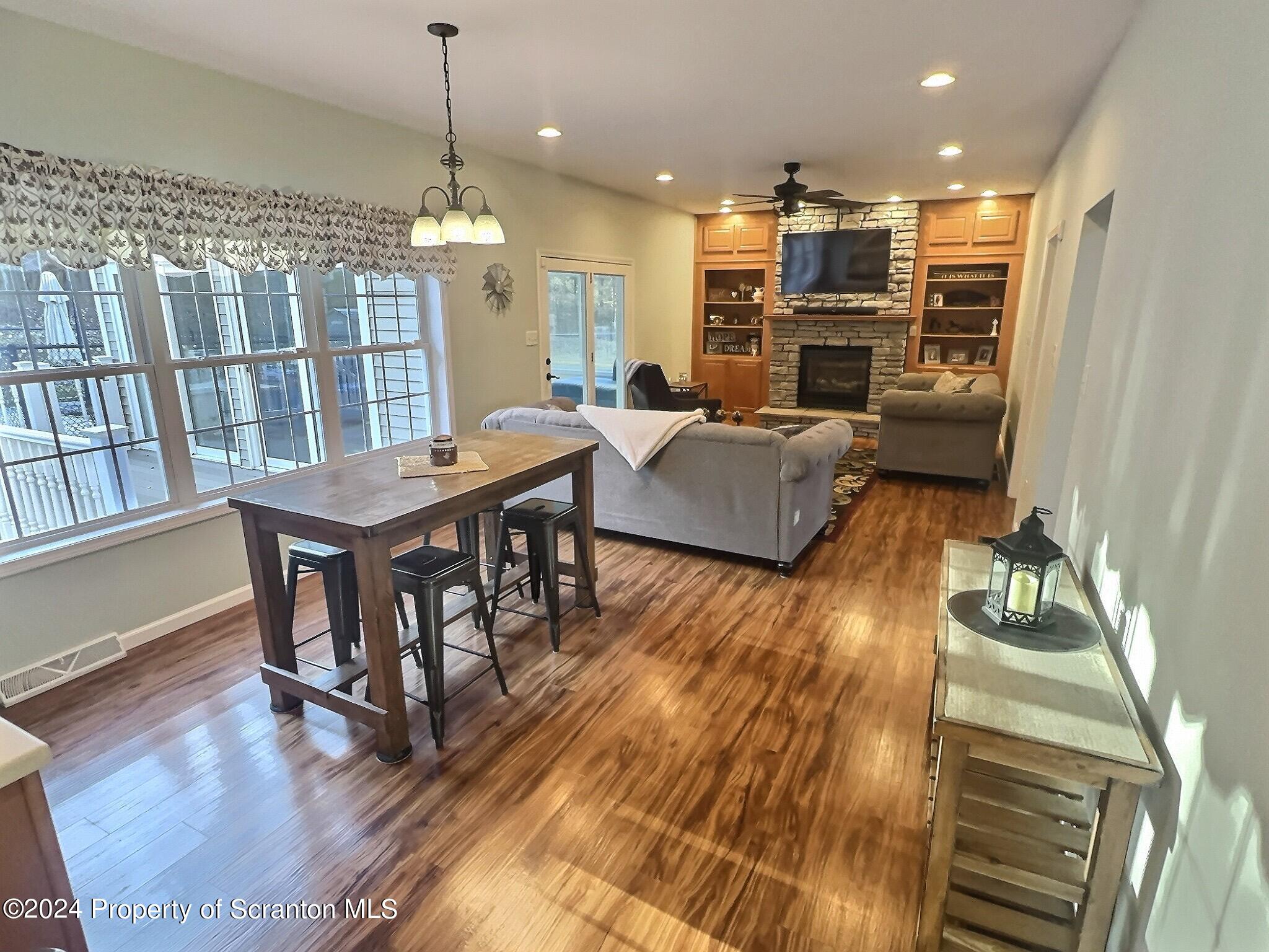514 Brace Road Dallas, PA 18612 - Photo 8 of 49 a view of a dining room with furniture window and wooden floor