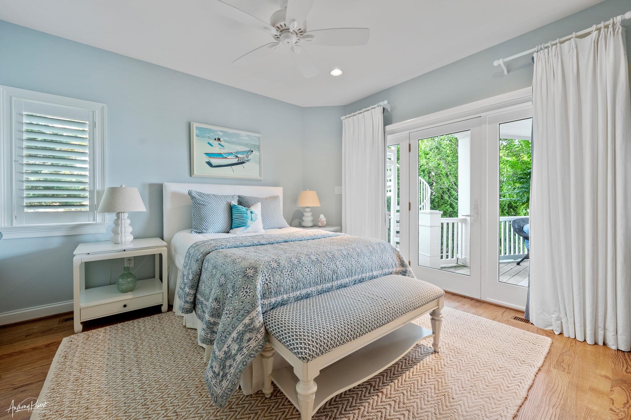 11 Heron Drive Avalon, NJ 08202 - Photo 11 of 29 a spacious bedroom with a bed and a large window