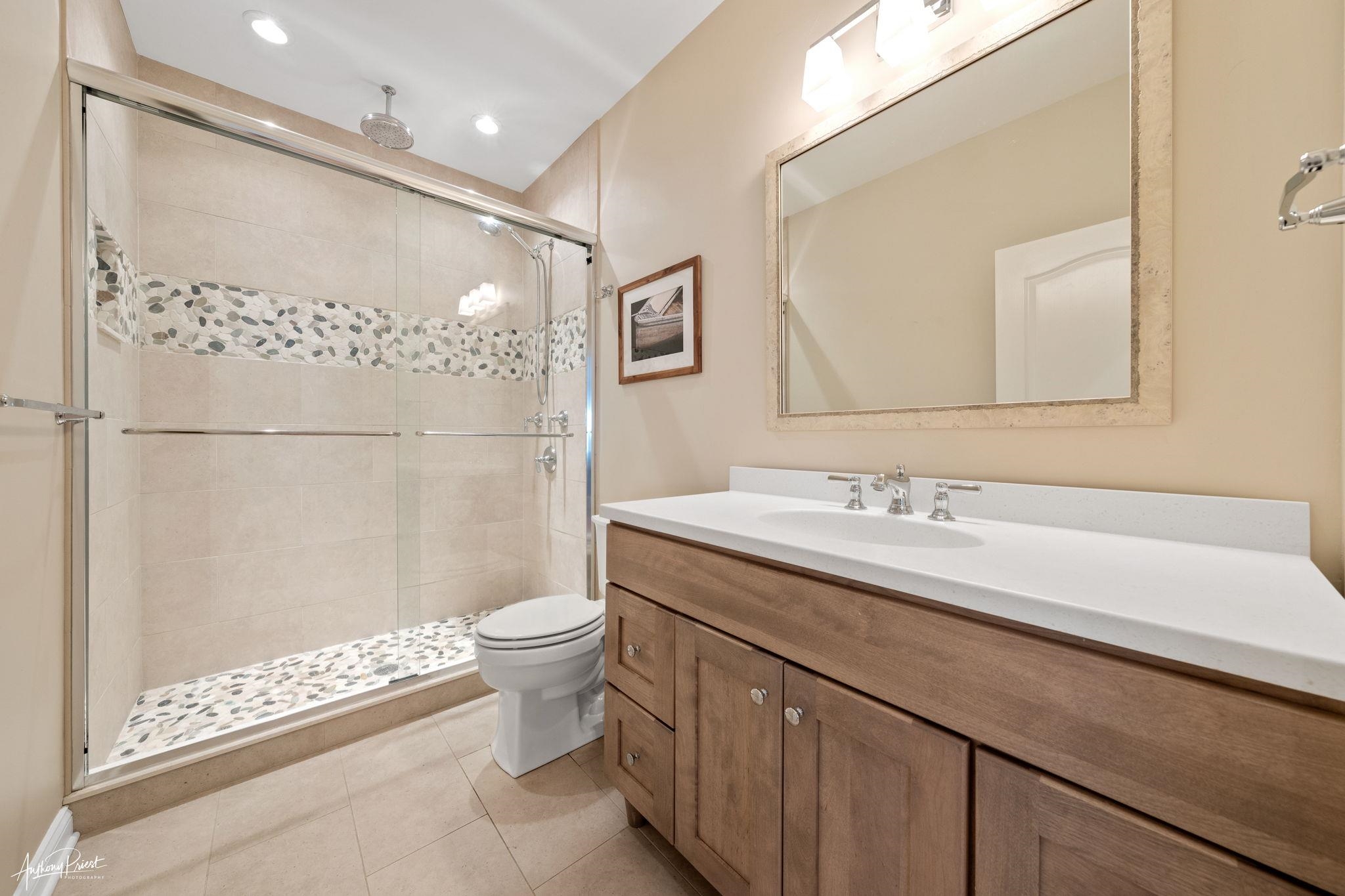 11 Heron Drive Avalon, NJ 08202 - Photo 12 of 29 a bathroom with a double vanity sink mirror and toilet