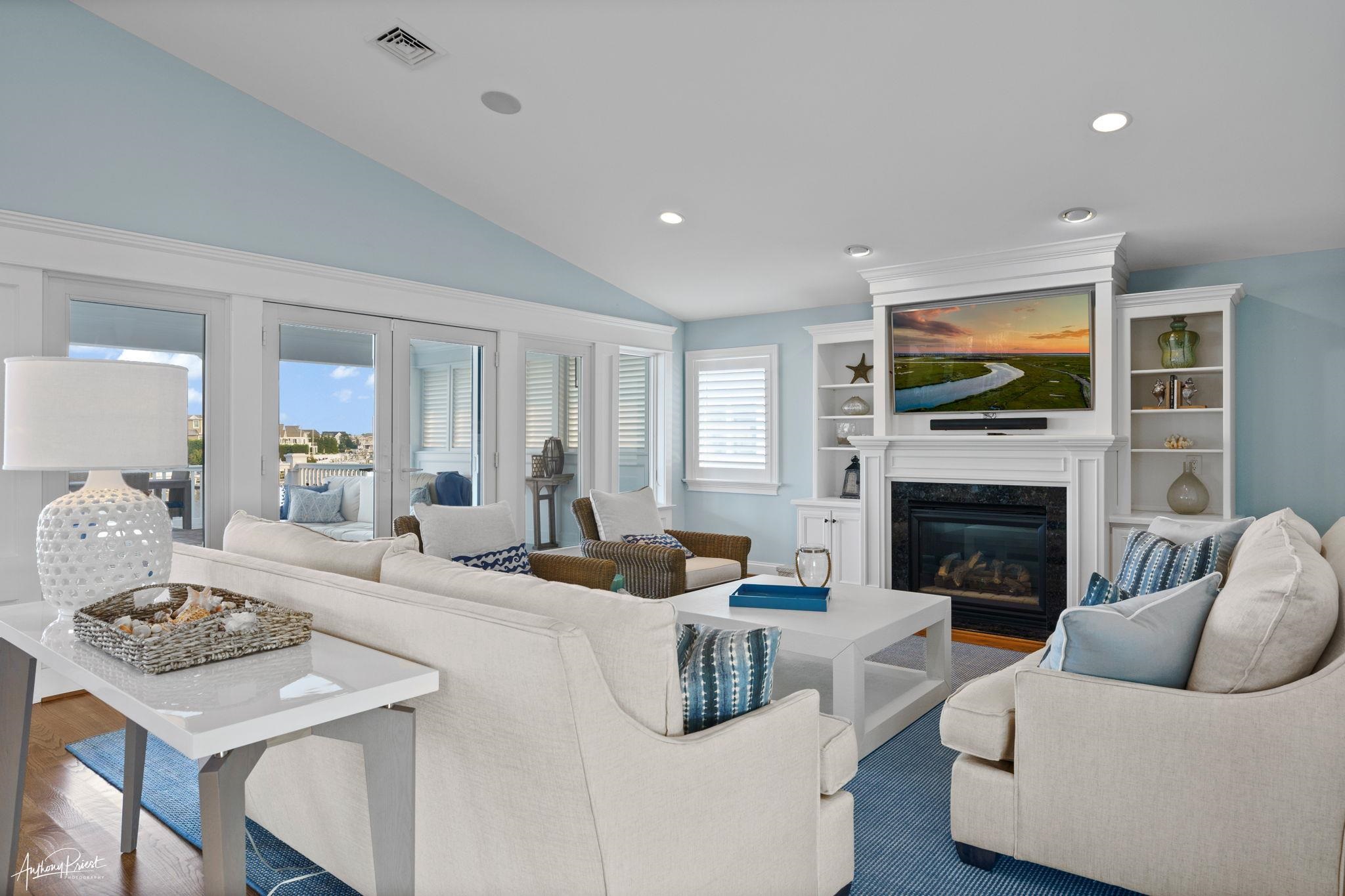11 Heron Drive Avalon, NJ 08202 - Photo 19 of 29 a living room with furniture fireplace and flat screen tv
