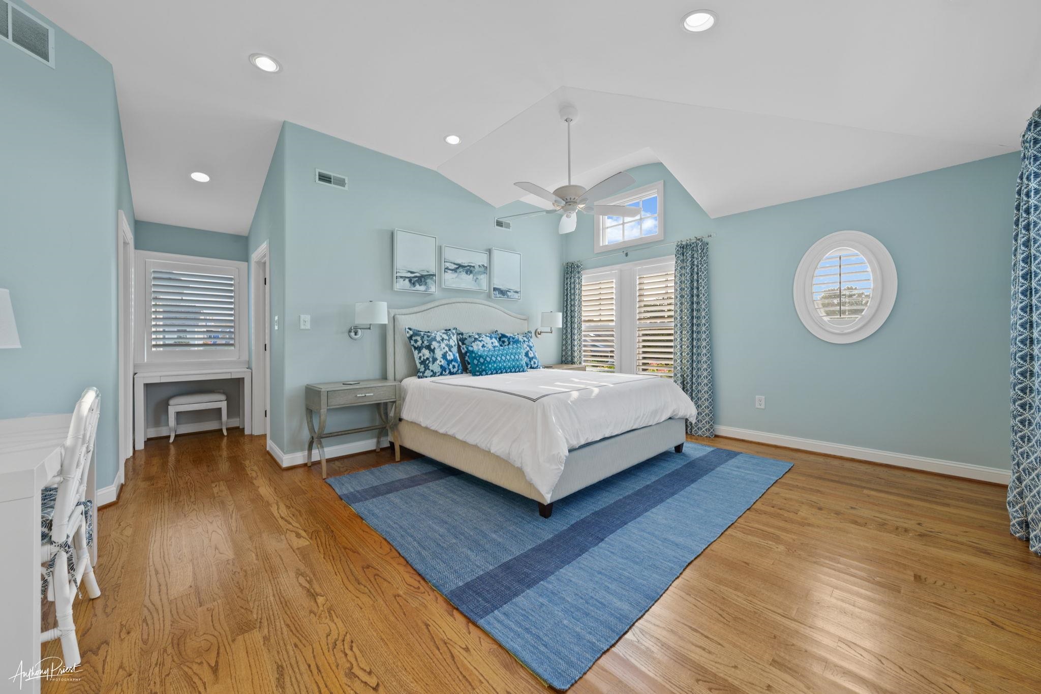 11 Heron Drive Avalon, NJ 08202 - Photo 27 of 29 a bedroom with a bed and a chandelier