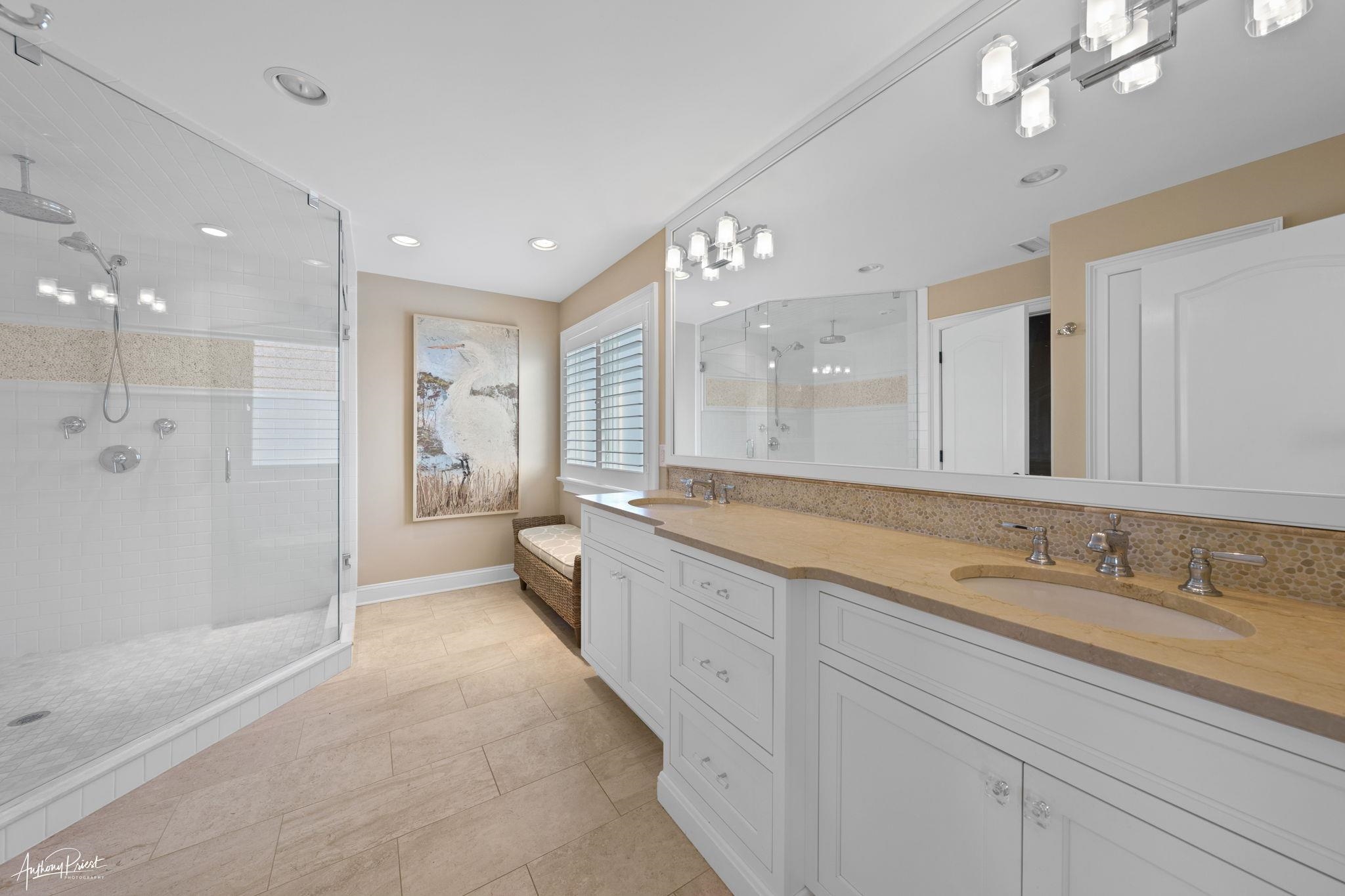 11 Heron Drive Avalon, NJ 08202 - Photo 29 of 29 a spacious bathroom with a shower a sink and mirror