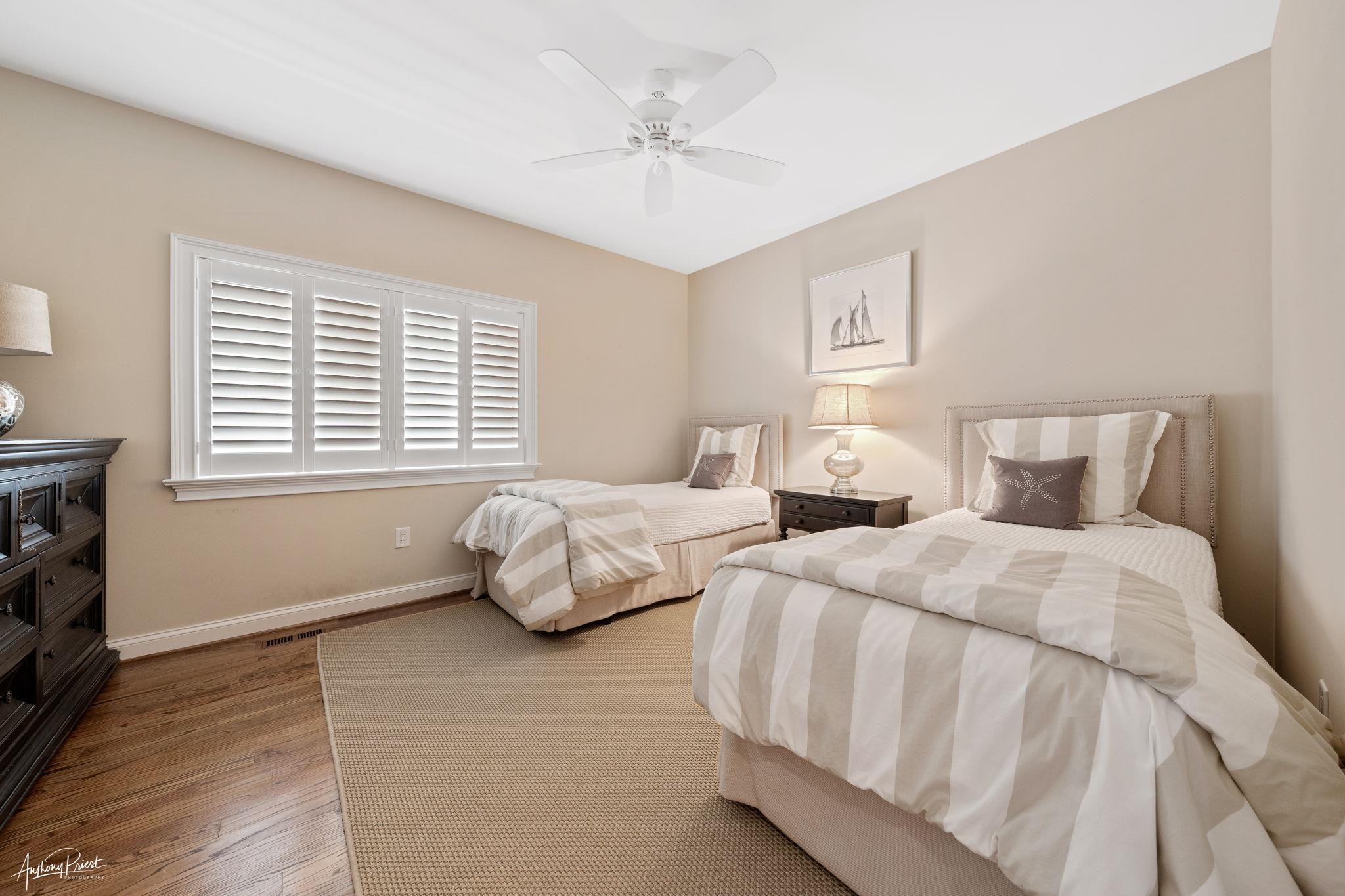 11 Heron Drive Avalon, NJ 08202 - Photo 9 of 29 a bedroom with two beds and a window