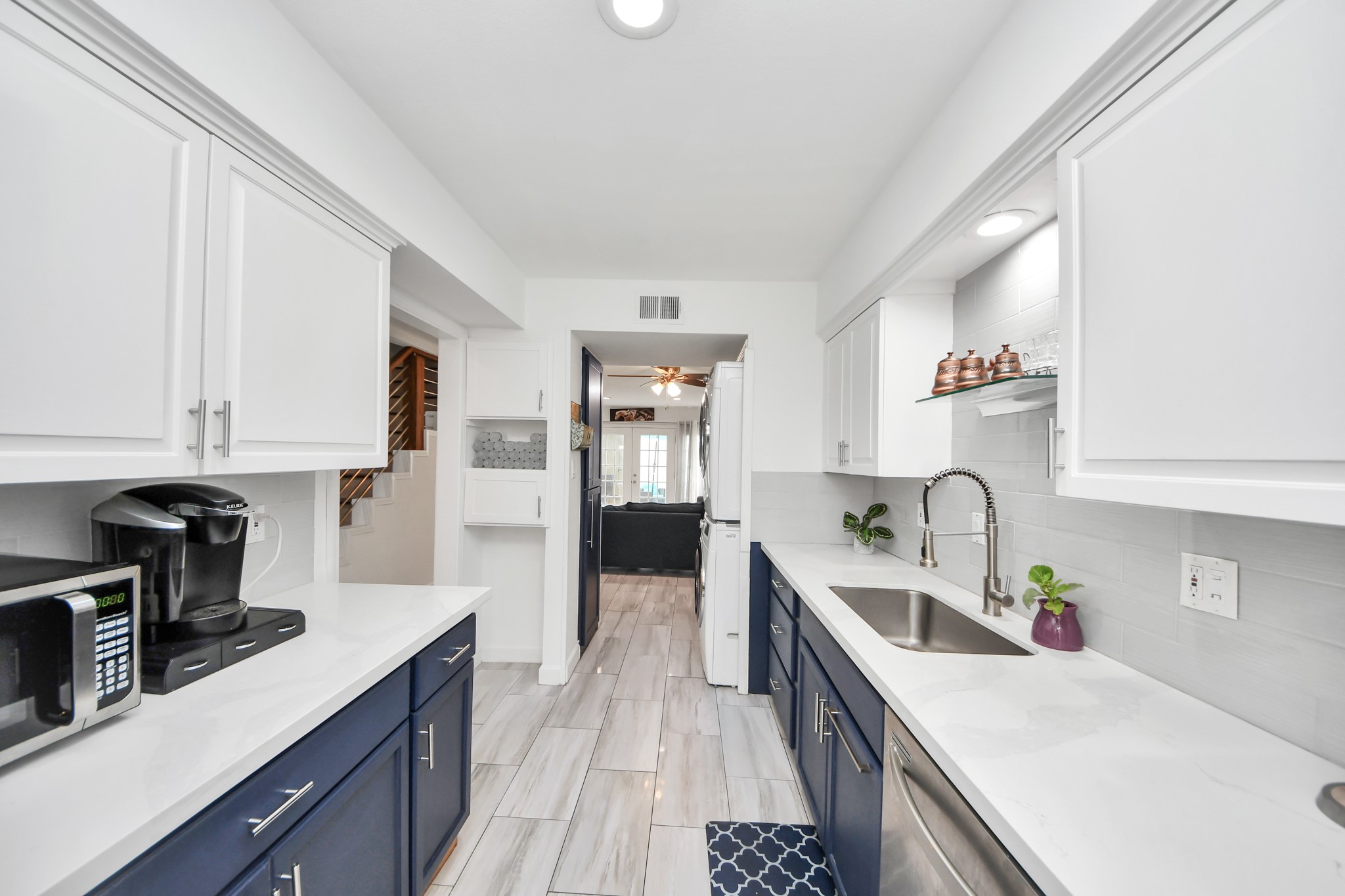 12757 Huntingwick Drive, Unit 142 Houston, TX 77024 - Photo 13 of 36 Well-appointed kitchen with contemporary finishes, generous counter space, and a functional layout.