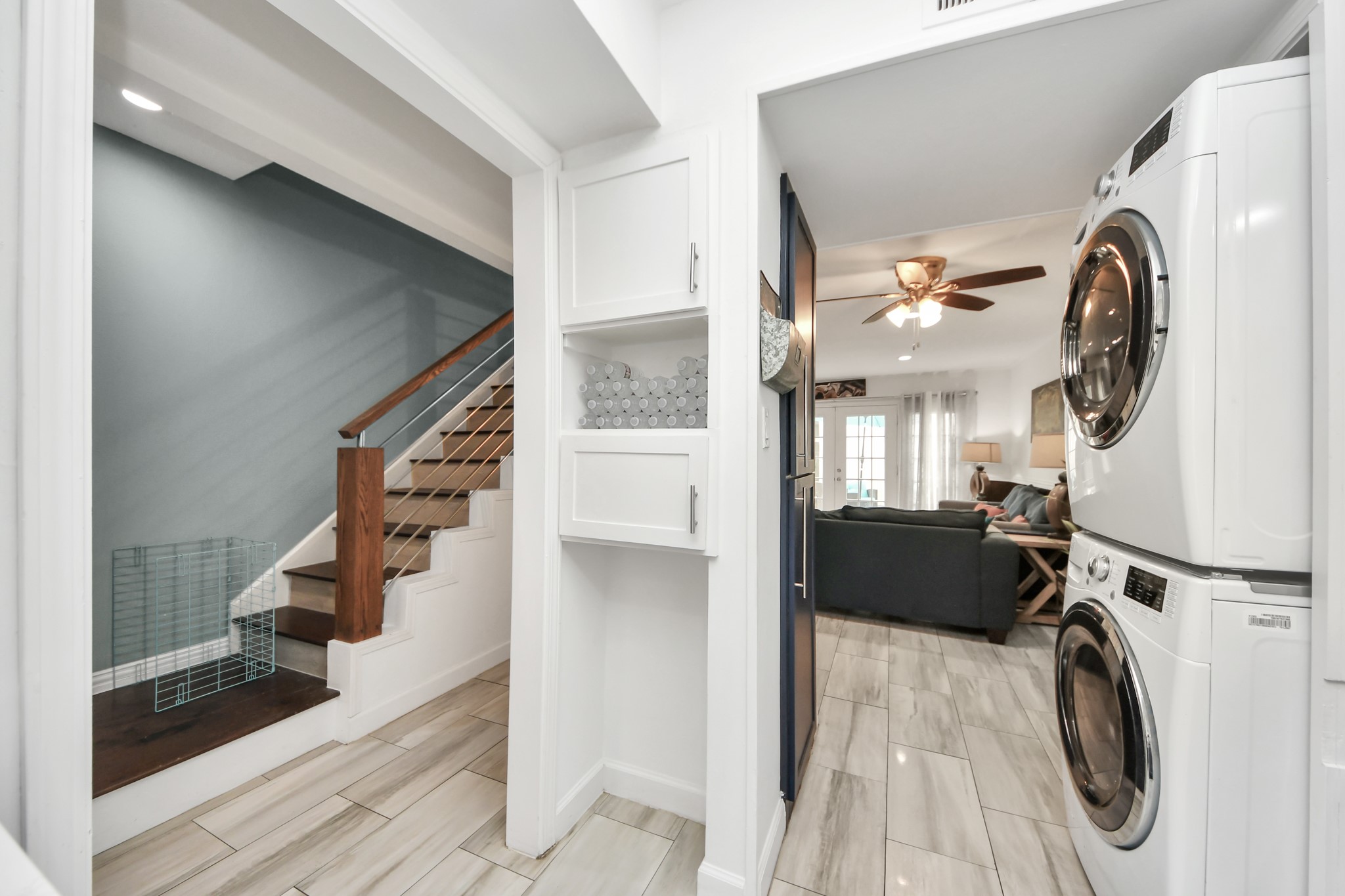 12757 Huntingwick Drive, Unit 142 Houston, TX 77024 - Photo 17 of 36 Clean and modern kitchen designed for efficiency with ample storage, stainless steel appliances, and in-unit washer and dryer.