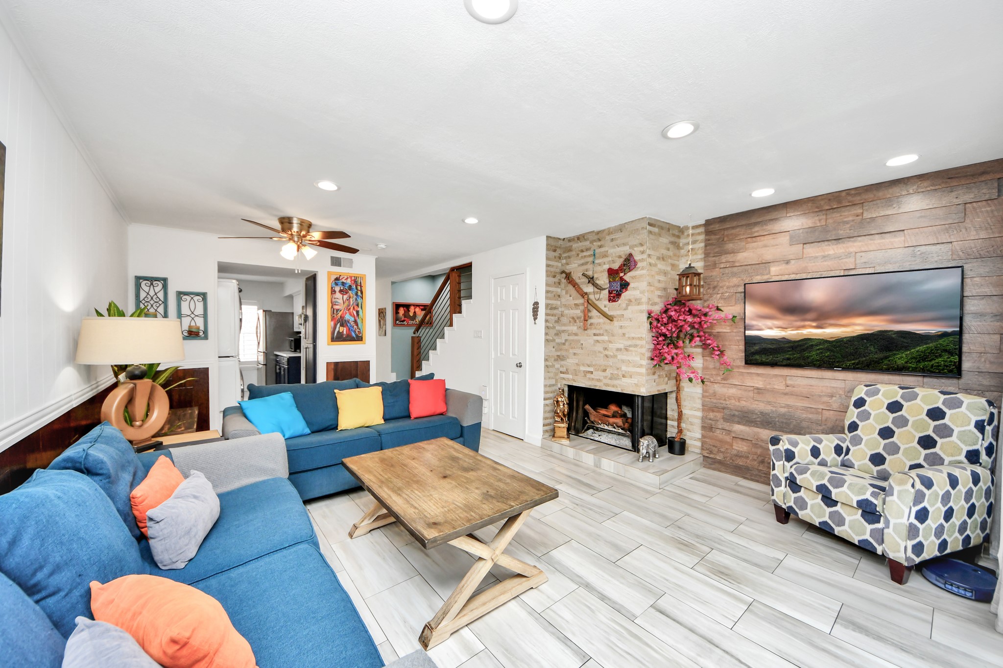 12757 Huntingwick Drive, Unit 142 Houston, TX 77024 - Photo 21 of 36 Well-lit living and dining space with tile floors, recessed lighting, and French doors enhancing the open feel.
