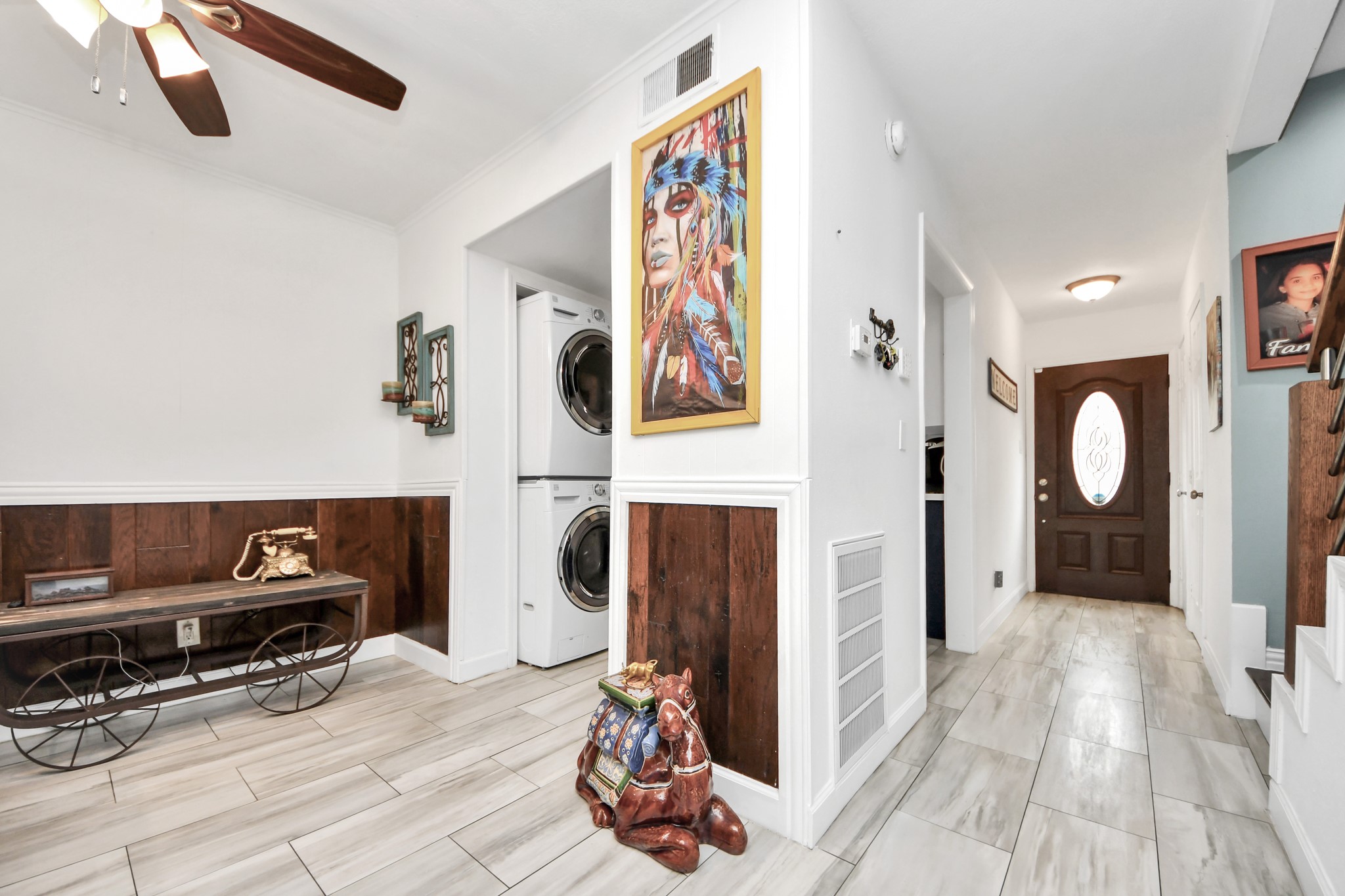 12757 Huntingwick Drive, Unit 142 Houston, TX 77024 - Photo 22 of 36 View from the living area highlighting the hallway connecting the entry and kitchen