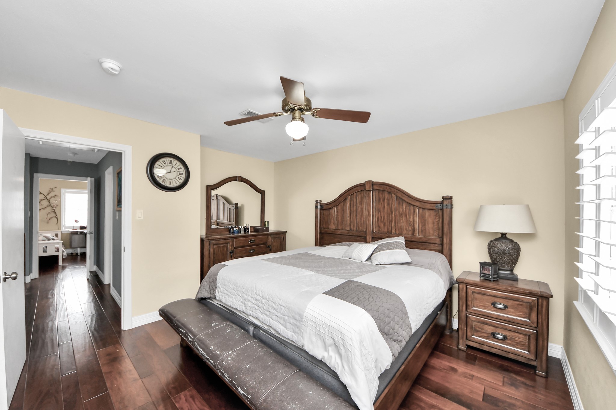 12757 Huntingwick Drive, Unit 142 Houston, TX 77024 - Photo 30 of 36 Primary bedroom offering a comfortable layout with engineered wood floors and ample natural light.